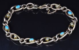Edwardian 9ct rose gold bracelet set with turquoise and seed pearls, 7.7g