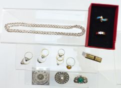 A collection of silver jewellery including eight silver rings, filigree brooches, lighter, etc