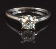An 18ct white gold ring set with a round cut diamond of approximately 0.4ct, size I, 2.1g