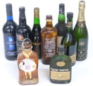 Nine bottles of mixed wine and spirits including three of brandy, Remy Martin, Camus Napoleon Cognac