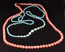 A beaded coral necklace of 91 round beads with a 9ct gold clasp and another of alternating ivory and