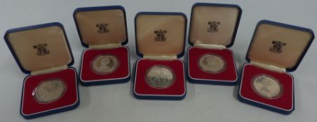 Five cased Royal Mint Silver Royal Commemorative crowns for 1977, Tristan Da Cunha, St Helena etc