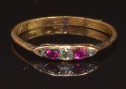An early 20thC 18ct gold ring set with old cut diamonds and rubies, size R, 1.9g