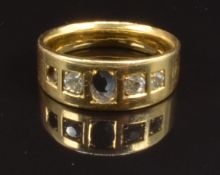An 18ct gold ring set with three diamonds, size M, 6.4g