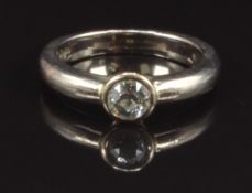 An 18ct gold ring set with a round cut diamond of approximately 0.3ct, size H, 4.8g