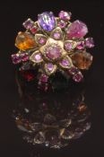 A yellow metal ring set with sapphires, rubies, garnets, amethyst, topaz and citrine, size Q, 6.1g