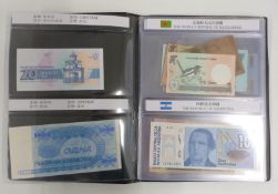 World Paper Money albums containing approximately 35 uncirculated banknotes with labelled ages