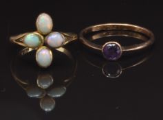 A 9ct gold ring set with an amethyst, size M and a 9ct gold ring set with opals, size G, 3.3g