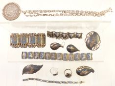 A silver pendant set with a 1899 silver dollar and a quantity of Siam silver jewellery including