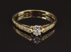 A 9ct gold ring set with a diamond and with diamond encrusted shoulders, size N, 1.6g