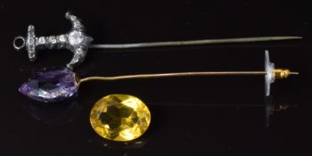Victorian stick pin set with paste in the form of an anchor and a yellow metal stick pin set with