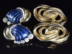 A pair of Givenchy earrings and another designer pair