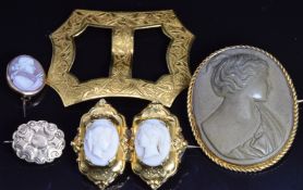 A yellow metal buckle with chased decoration, a c1900 lava cameo brooch, Victorian brooch and two