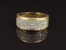 A 9ct gold ring set with three rows of cubic zirconia, size Q, 3.3g