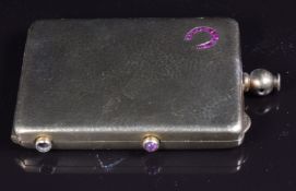 A c1920 hammered silver gilt compact set with rubies in a horseshoe, 5.5 x 4cm