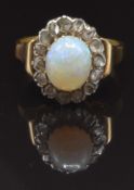 Victorian ring set with an oval opal cabochon surrounded by rose cut diamonds, size K, 4g