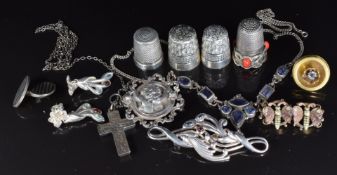 A silver necklace, silver brooches, silver earrings, Victorian cross pendant, silver thimbles, etc