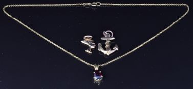 Two 9ct gold pendants, one in the form of an anchor, 2.5g, and a gold plated pendant set with a