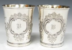 Pair of Georgian hallmarked silver beakers with gilt wash interiors and embossed decoration,