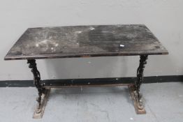 A refectory bar table on cast iron base