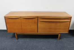 A mid century teak low sideboard