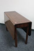 A Victorian mahogany drop leaf table