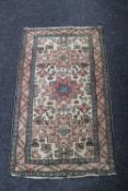 A Persian hearth rug