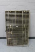 A folding metal dog cage