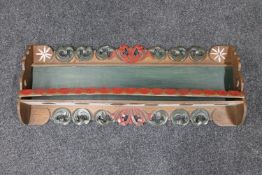 A painted oak wall shelf