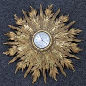 A gilt wood sunburst wall clock CONDITION REPORT: Diameter 53cm.