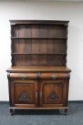 An Edwardian mahogany Arts and Crafts dresser