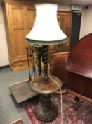 An Edwardian carved oak standard lamp