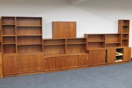An eighteen piece mid century Danish teak shelving system