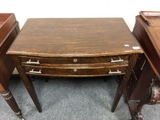 An Edwardian oak two drawer cutlery table,