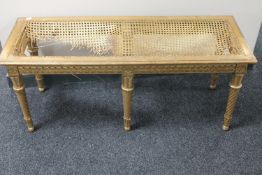 A gilt wood bergere duet stool,