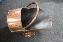 A Victorian copper coal helmet