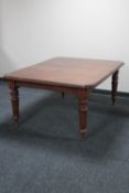 A Victorian mahogany wind-out dining table