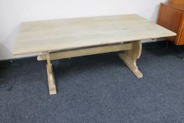 A blond oak refectory coffee table