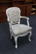 A continental painted armchair upholstered in tapestry fabric