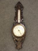 An Edwardian carved barometer