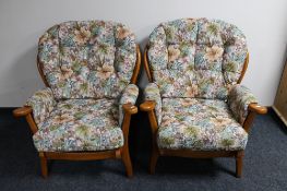 A pair of late 20th century wingback armchairs in floral fabric