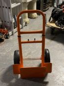 An adjustable twin handled sack barrow with spring axle