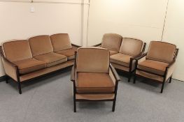 A 20th century Danish four piece lounge suite in brown dralon