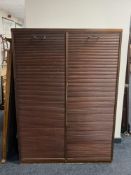 A 20th century double shutter door office cabinet