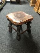 An Arts and Crafts leather seated stool