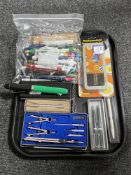 A tray of assorted pens and drawing instruments