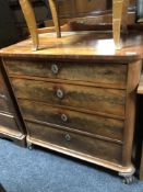 A 19th century mahogany four drawer chest on paw feet