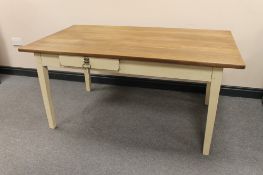 An oak topped pine based kitchen table fitted two drawers