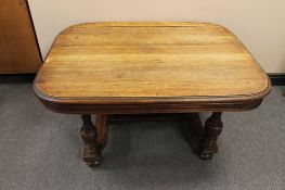 A continental oak coffee table on bun feet