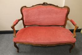 A French carved walnut framed salon settee in pink dralon